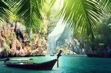 Boat and rocks on railay beach in Krabi Boat and rocks on railay beach in Krabi